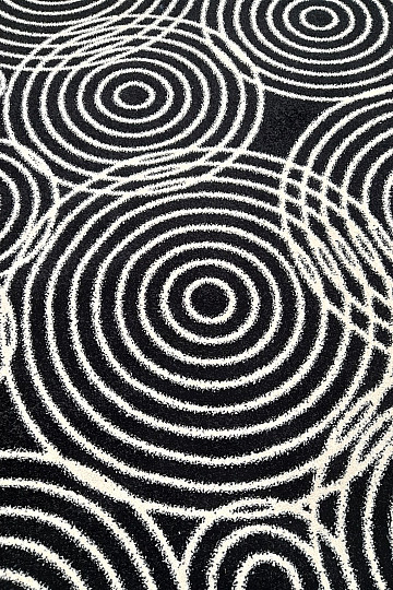 Tapis à cercles noirs et blancs