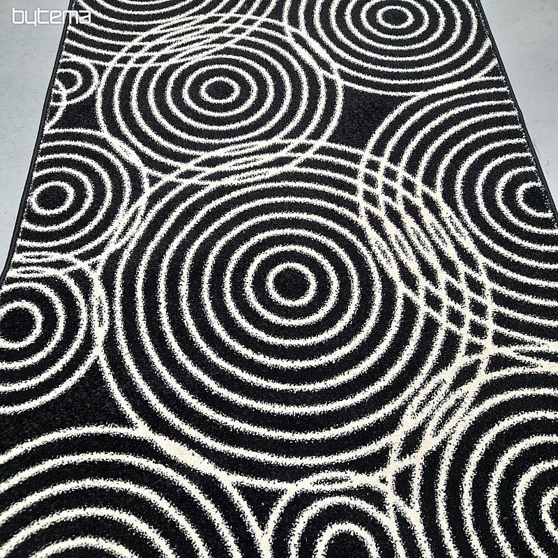 Tapis à cercles noirs et blancs