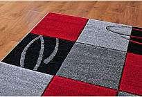 Les tapis en pièces fabriqués à partir de fibres synthétiques sont moins chers. Comment choisir ?