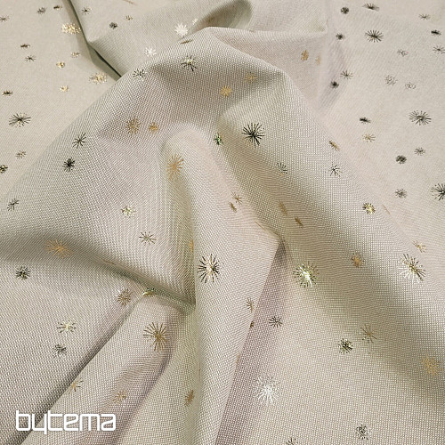 Tissu en toile de coton à motifs détoiles dorées sur la planche à découper